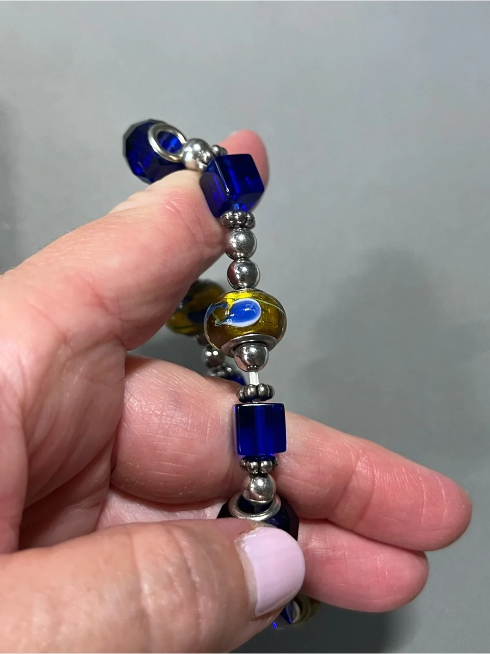 NWOT beautiful blue and yellow plastic beads with silver tone beads in between.
